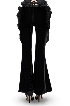 Gothic velvet flare pants rear view showing lace-up corset waist and side ruffled lace decorations