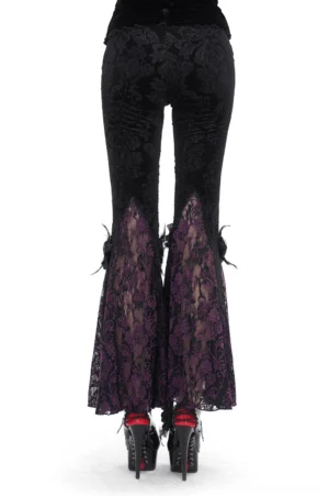Gothic velvet flared pants rear view on model with platform heels, damask pattern and purple lace cuff details