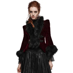 Front three-quarter view of embossed velvet gothic short jacket with black faux fur collar and cuffs, worn by model with wine red jacquard fabric and decorative frog button closure