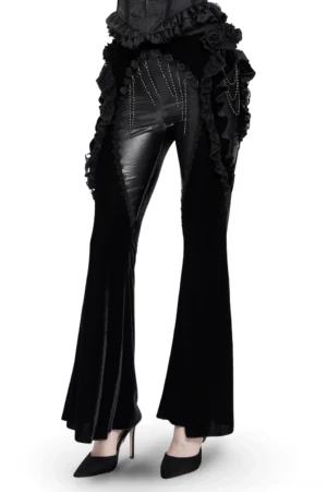Black velvet and synthetic leather gothic flare pants with cascading lace ruffles, front view on model with platform heels