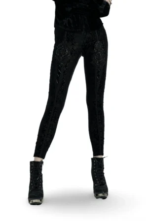 Black velvet burnout gothic leggings with beaded floral detail front three-quarter view on model