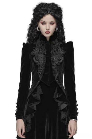 Victorian Gothic black velvet tailcoat with ornate lace embroidery worn by model, front view with puff sleeves and decorative buttons
