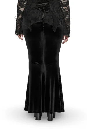 Black velvet gothic pants back view showing lace-up corset back detail and flared hem on model