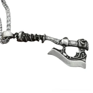 Antique black Viking axe pendant with textured spiked handle design on decorative chain