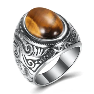 Gothic vintage ring with polished tiger eye brown gemstone in engraved silver steel frame