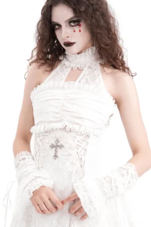 Gothic bridal ensemble featuring white lace fingerless gloves with black lace dress and cross corset ornament