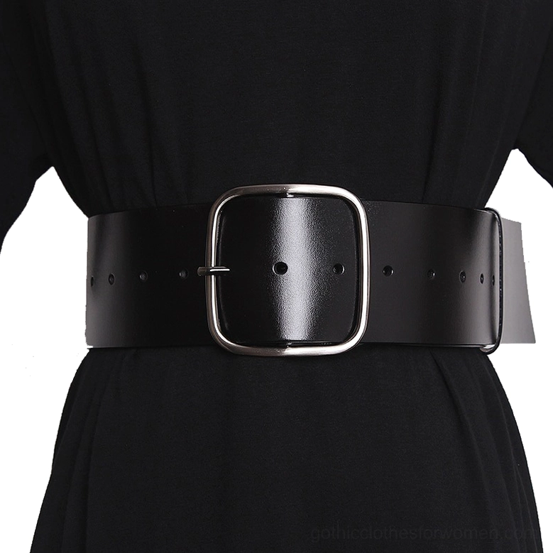 Wide black leather corset belt with square metal buckle worn on female torso in black dress, front waist view