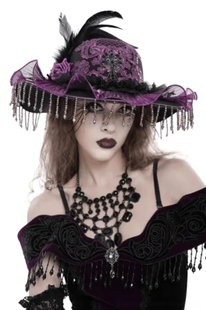 Purple gothic wide brim hat with lace cross emblem and beaded fringe - front view on model