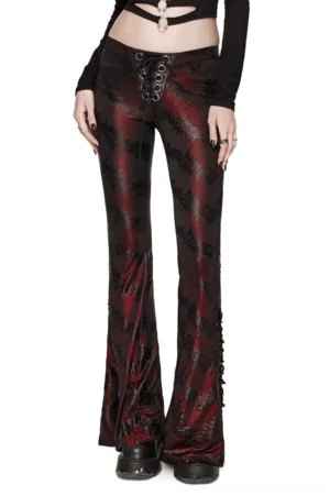Wine red gothic sparkly flared pants front view worn by model, showing lace-up corset waistband detail and dramatic flare silhouette