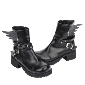 Black winged rivet gothic ankle boots with buckle strap and platform heel - front three-quarter view showing wing decorations and metallic rivets