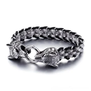 Gothic wolf head stainless steel leather bracelet with dual wolf clasp, braided metal and leather weave design, top-down view