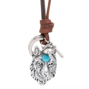 Vintage brown leather gothic wolf necklace with detailed silver wolf head pendant featuring turquoise inlay, front close-up view on white background