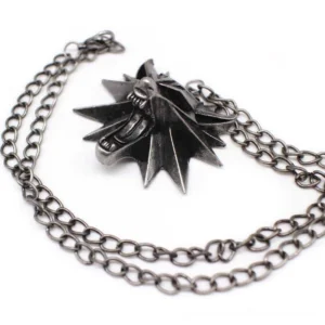 Spiked wolf head gothic pendant necklace with antiqued silver metal finish, overhead side view showing fierce wolf profile with dimensional spike details