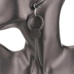 Pink wooden bead drop earrings with silicone tassels, close-up front view showing neo-gothic dark aesthetic jewelry design