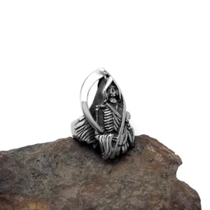 Grim Reaper gothic biker ring carved skeleton detail side angle stone background