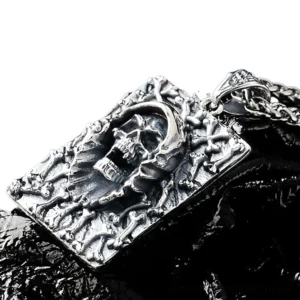 Gothic skull pendant on black leather overhead angle showing three-dimensional hooded reaper relief and intricate details