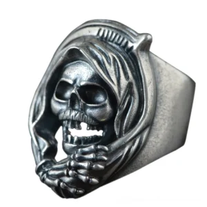 Grim reaper skull ring front angled perspective highlighting intricate death skull carving and matte silver patina - gothic memento mori jewelry design