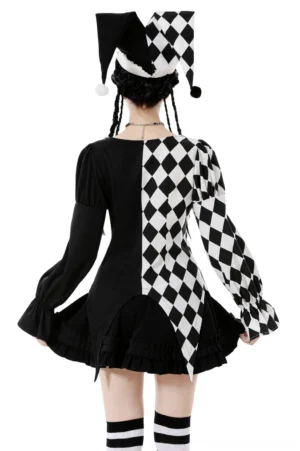 Harlequin gothic blouse back view, model in rear pose showing solid black back panel with checkerboard sleeve details