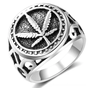 Vintage hemp leaf gothic signet ring with polished silver finish and ornate hollow band, front overhead view on white background