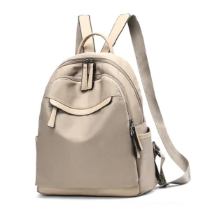 Khaki minimalist daypack front display, adjustable straps and curved front pocket design