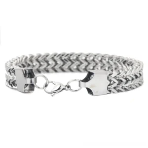 Side profile of layered chain bracelet displaying box clasp adjustment ring and polished silver metallic finish