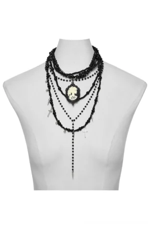 Multi-strand gothic black beaded necklace with cameo pendant displayed on mannequin torso, layered beads design