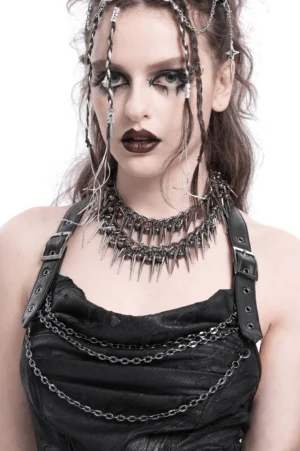 Double layered spike choker worn with black leather halter top, showcasing full neckline impact and alternative fashion styling