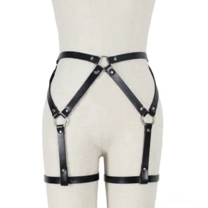Gothic leather harness on dress form displaying crisscross strap configuration and adjustable waist clips, front perspective