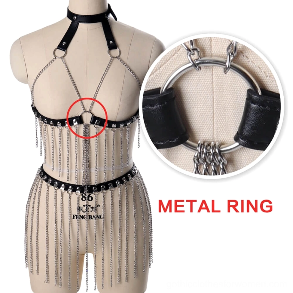 Close-up detail shot of metal ring joint connection on black leather body harness showing construction quality