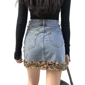 Denim mini skirt with leopard fuzzy trim back view, high waisted construction detail