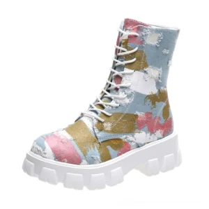 Light blue abstract print gothic canvas combat boots with white lug platform sole, displayed from left three-quarter angle in studio lighting