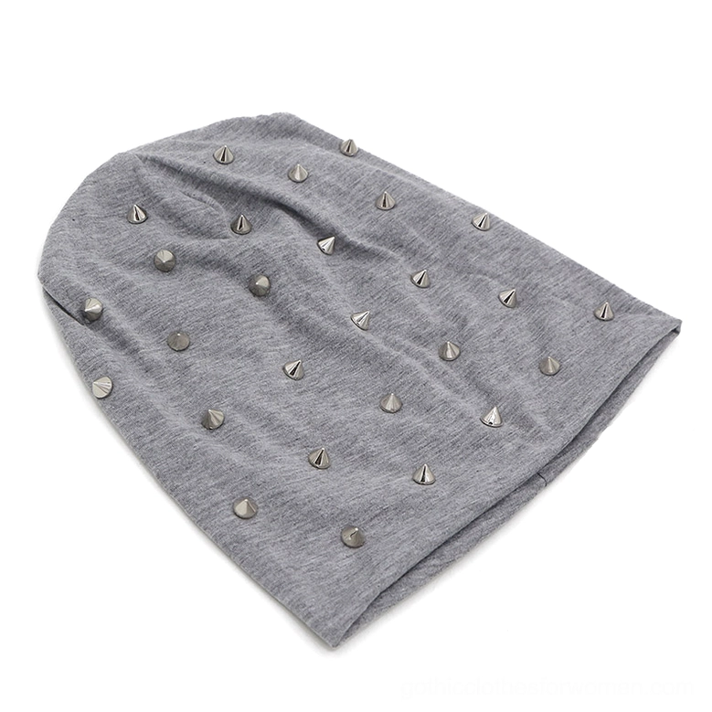 Light gray heather gothic studded slouch beanie with silver metal cone studs and relaxed drape, flat lay