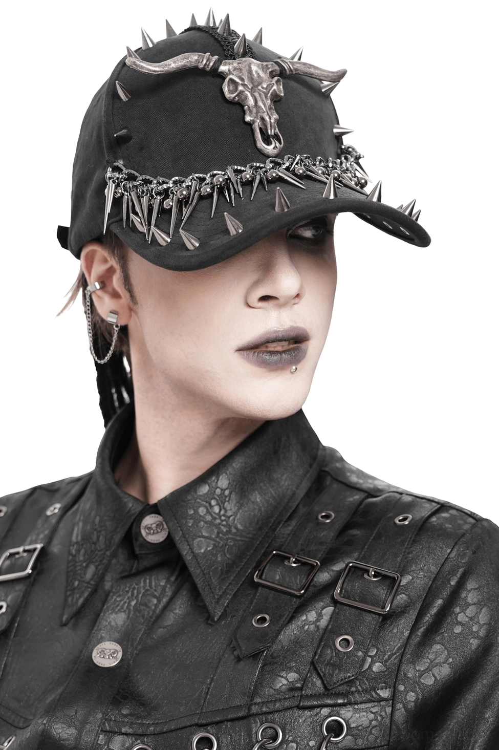 Black metal spike bull skull gothic baseball cap front close-up view on male model with detailed spike and chain trim design