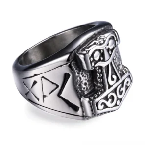 Mjolnir hammer gothic biker ring in aged 316L stainless steel with embossed Norse design and rune engravings, oblique top view