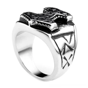 Viking signet ring featuring Thor's hammer Mjolnir crown with detailed rune engravings on the band, front perspective