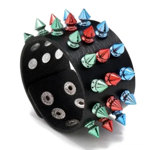 Multicolor three-row spike gothic leather cuff bracelet in black with red blue and green metal cone studs, top oblique view showing full spike arrangement
