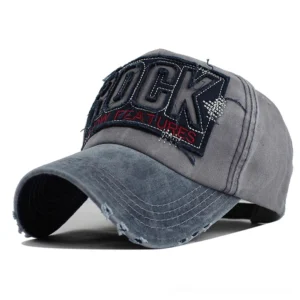 Navy and blue washed gothic baseball cap front three-quarter view with ROCK embroidered patch and frayed brim