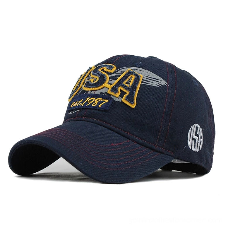 Navy blue USA embroidered baseball cap with yellow and gray lettering, red contrast stitching, dark alternative style