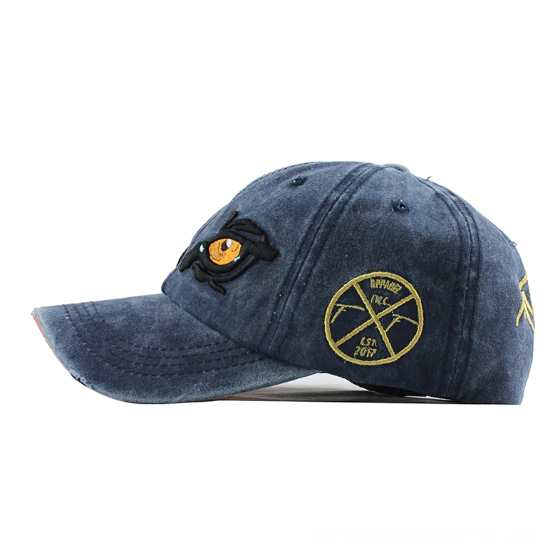 Navy gothic baseball cap side view with golden badge detail alternative fashion