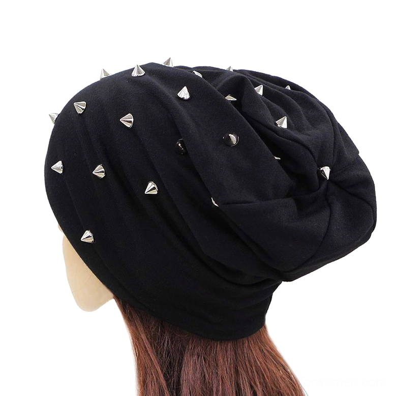Navy blue studded slouch beanie with scattered silver metal cone studs, rear view showcasing drape