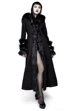 Gothic black long winter coat with faux fur hood and trim, front full-body view on female alternative model wearing statement goth outfit