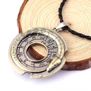 Vintage zodiac amulet gothic necklace with hollow circular rune design and engraved occult symbols, displayed on wooden background