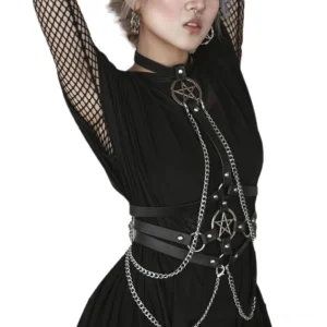 Black leather pentagram chain harness detail view showing silver chains and pentagram pendant on model with facial piercings