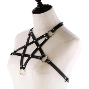 Black leather pentagram chest harness with metal rivets and adjustable straps, three-quarter front angle on dress form