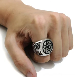Pentagram ring worn on male hand middle finger side overhead view showing side pentagram detail