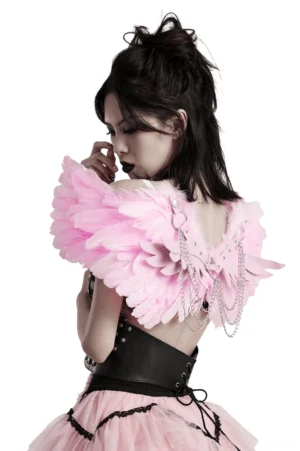 Pink feathered angel wing harness with silver chains displayed on model in three-quarter view against white background
