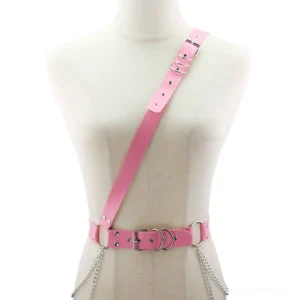 Pink PU leather adjustable body harness with metal hardware and chain details, studio display
