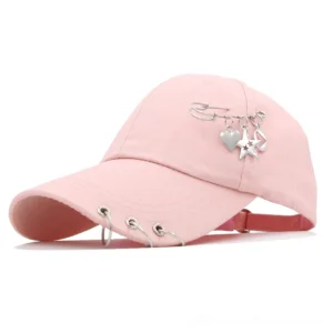 Pink gothic punk baseball cap with metal ring piercing and decorative charms - front view