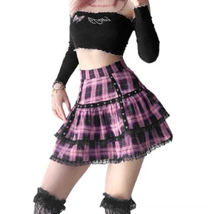 Black and purple plaid ruffle mini skirt with high empire waist, shown on female model from side angle with off-shoulder styling and gothic fashion aesthetic