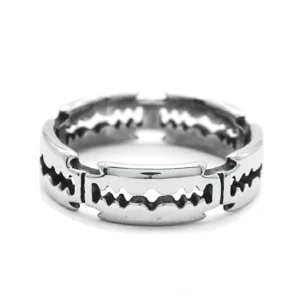 Front overhead view of razor blade pattern ring, embossed sawtooth details, stainless steel silver band, alternative jewelry
